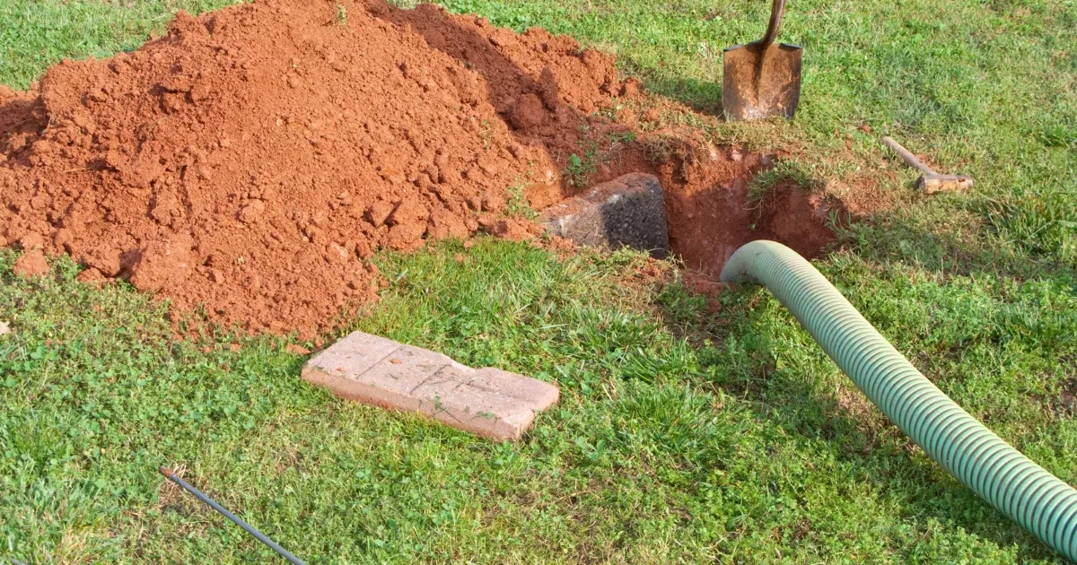 septic tank and plumbing tube with soil around it