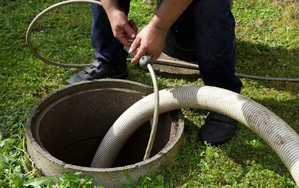 a person cleaning the septic system
