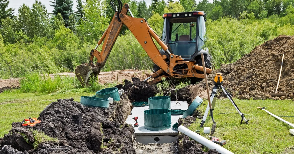 A plumber installing a custom septic trench in a backyard. What is an Absorption Trench